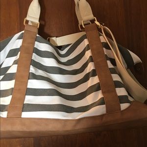 Grey and white striped duffel bag, light use